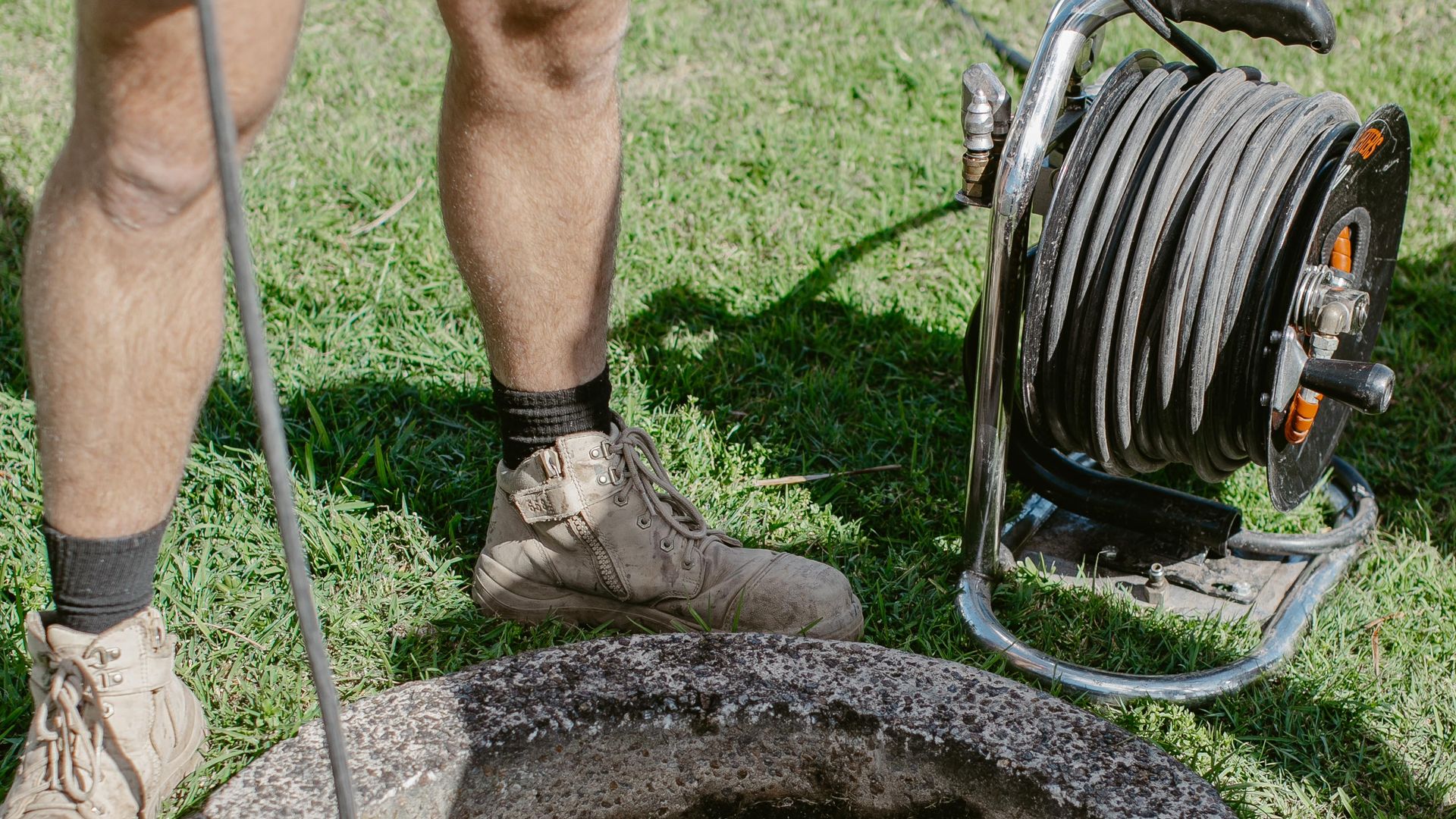 Rodding a sewer inspection shaft in Lake Macquarie