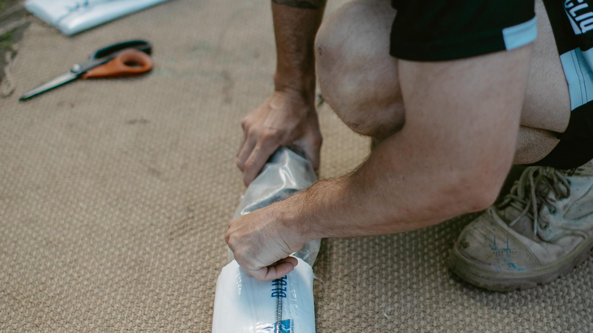 Rolling a resin impregnated liner ready for installation
