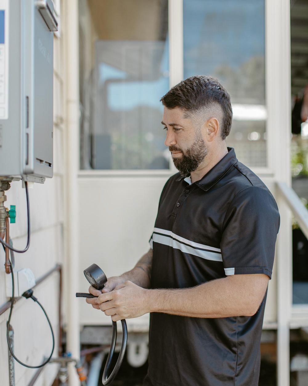 Adlington Plumbing testing a continuous flow hot water unit