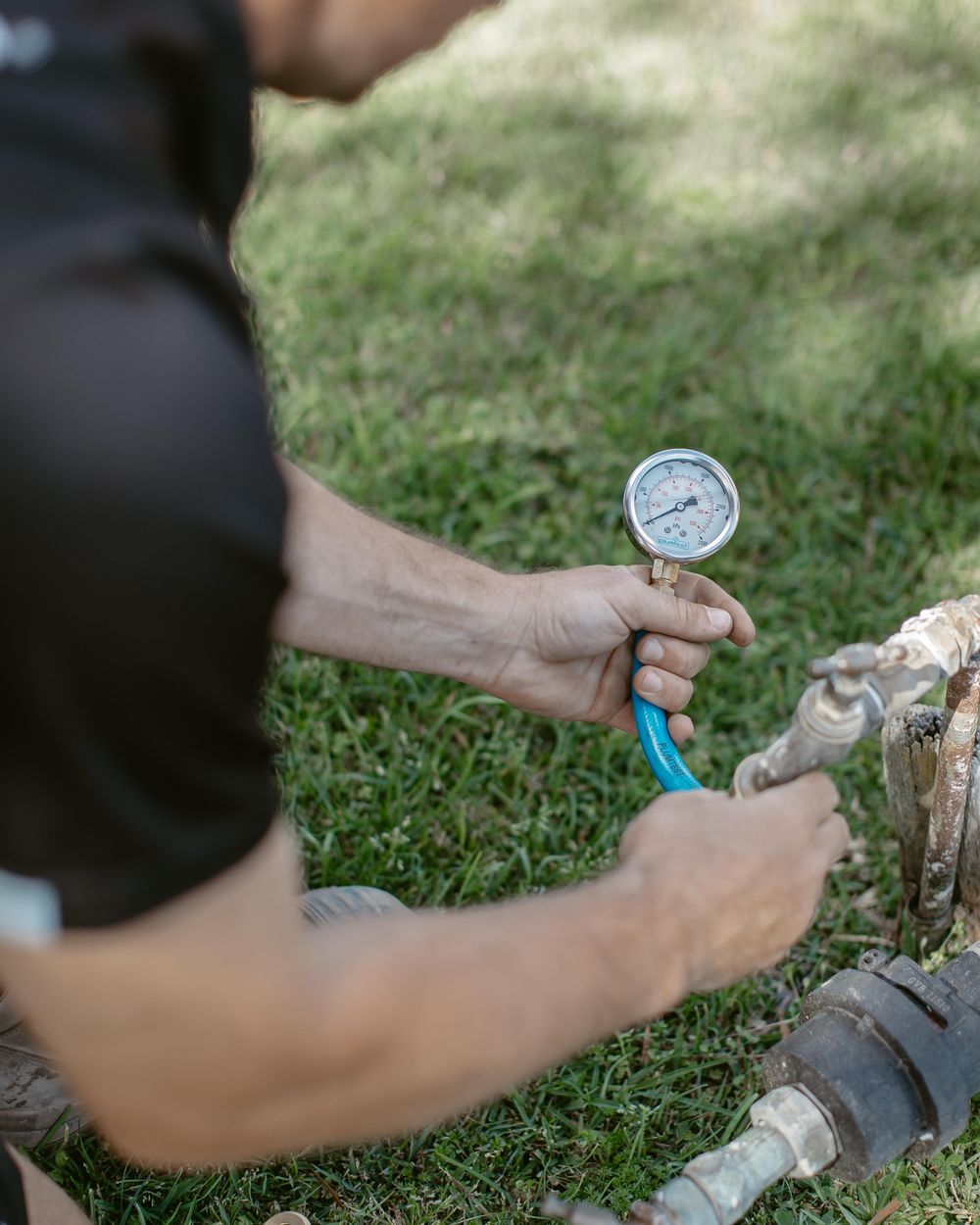 Pressure testing a water service with a gauge