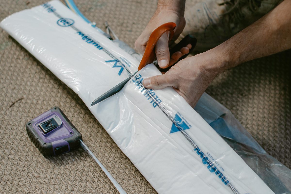 Rolling a resin impregnated liner ready for installation
