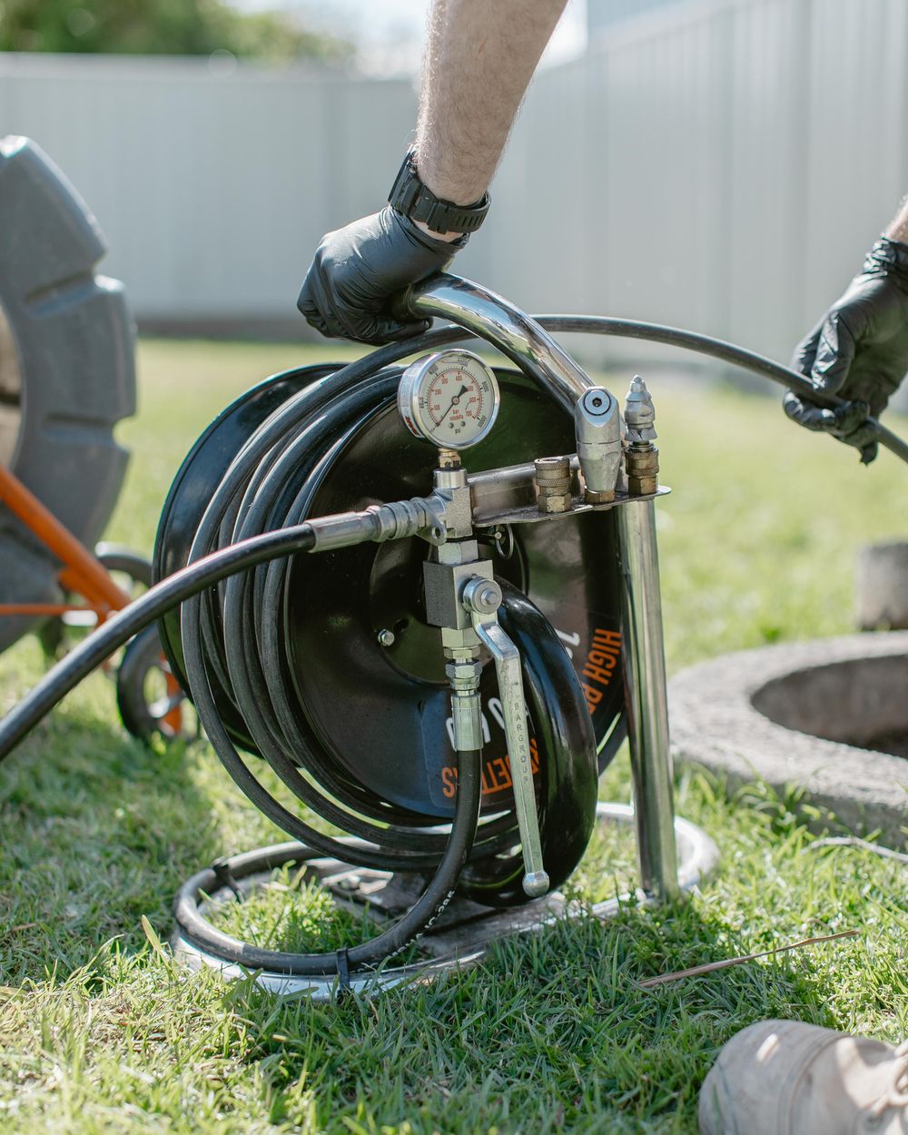 Drain jetting reel and pressure gauge at an inspection shaft